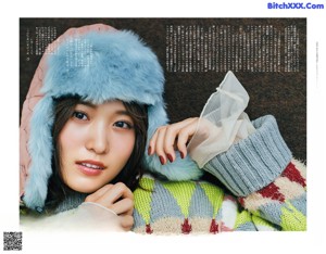 A magazine spread with a woman drinking a glass of wine.