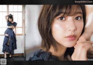 A woman in a black turtle neck sweater and a black skirt.