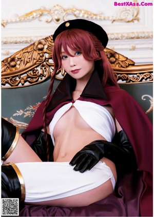 A woman in a white bikini and black gloves posing for a picture.